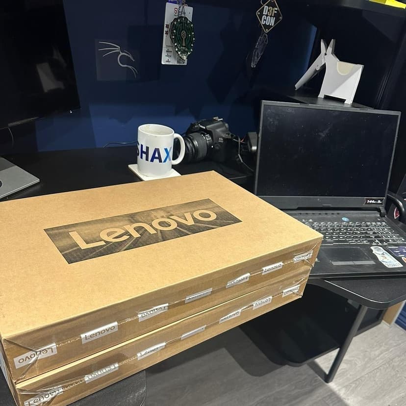 Two Lenovo laptops being set up